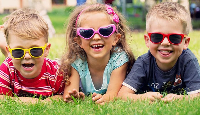 When should kids wear sunglasses for eye protection?